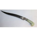 A FINE TURKISH JADE HANDLED KNIFE, "head of a ram", with damask blade. 17ins long.