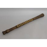 A TONGAN AFRICAN CLUB partly covered in split cane. 25ins long.