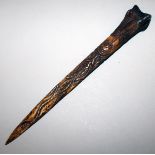 A CARVED BONE DAGGER, carved with lizard, and face, possibly AUSTRALIAN. 13.5ins long.