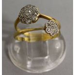 TWO SMALL DIAMOND GOLD SET RINGS.