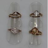 FOUR VARIOUS GOLD AND DIAMOND RINGS.