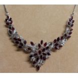 A GOOD 18K WHITE GOLD RUBY SET NECKLACE.