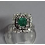 A VERY GOOD EMERALD AND DIAMOND SQUARE CLUSTER DRESS RING, set in white gold.
