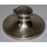 A PLAIN CIRCULAR CAPSTAN INKSTAND. 4ins diameter. Birmingham 1919.