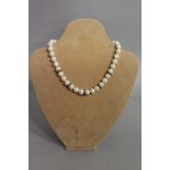 A GOOD PEARL, WHITE GOLD AND DIAMOND NECKLACE.