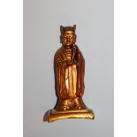 A GOOD 16TH/17TH CENTURY CHINESE MING DYNASTY GILT LACQUERED BRONZE FIGURE OF AN OFFICIAL, bearing a