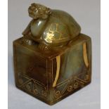 A GOLD INLAID SQUARE JADE SEAL with a turtle handle. 3ins high.