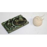 A CARVED IVORY FRUIT POMANDER, 3cms diameter, and A GREEN JADE DISH carved with a dragon, 8cms x