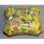 A SMALL CANTON SHAPED YELLOW BOX AND COVER decorated with pink peaches. Mark in blue. 2.75ins wide.