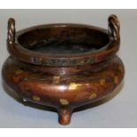 A SMALL CHINESE GOLD SPLASH BRONZE TWO HANDLED CENSER, unusual dragon and lizard mark. 4ins