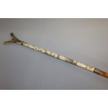 A CHINESE ANTLER AND MALACCA STAFF with presentation ferrule dated 1945. 50ins long.