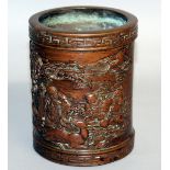 A CHINESE BRONZE CIRCULAR BRUSH POT, the sides with a scene of Shou Lou, animals and calligraphy.