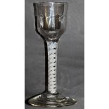 A GEORGIAN WINE GLASS with white opaque twist stem. 5.5ins high.