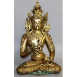 A LARGE CHINESE GILT BRONZE SEATED GOD. 15ins high.