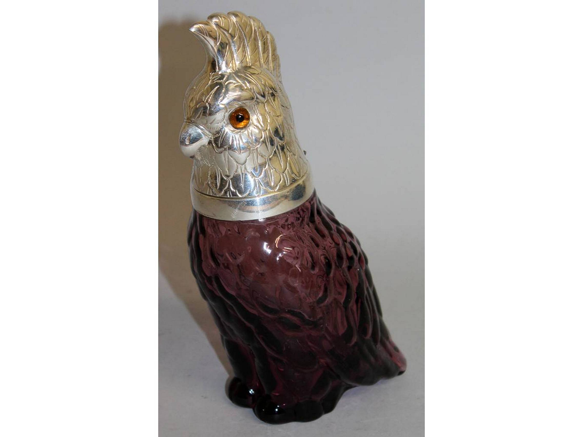 A SILVER PLATED AND RUBY GLASS CLARET JUG. 10ins high.