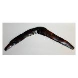 AN ABORIGINAL WOODEN BOOMERANG, CIRCA. 1880. 20ins long.