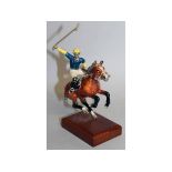 A GOOD SMALL ENAMEL AND SILVER MODEL OF A POLO PLAYER ON A HORSE, wearing No. 3.