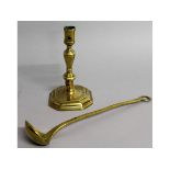 AN EARLY 18TH CENTURY CAST BRONZE CANDLESTICK, engraved I.S., 7.5ins high, and a BRASS LADLE.