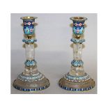 A GOOD PAIR OF RUSSIAN SILVER, ENAMEL AND ROCK CRYSTAL CANDLESTICKS on circular bases. 7.5ins high.