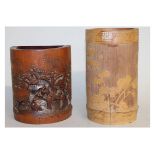 A 19TH/20TH CENTURY CHINESE CARVED BAMBOO BRUSHPOT, the sides carved in shallow relief with a bird