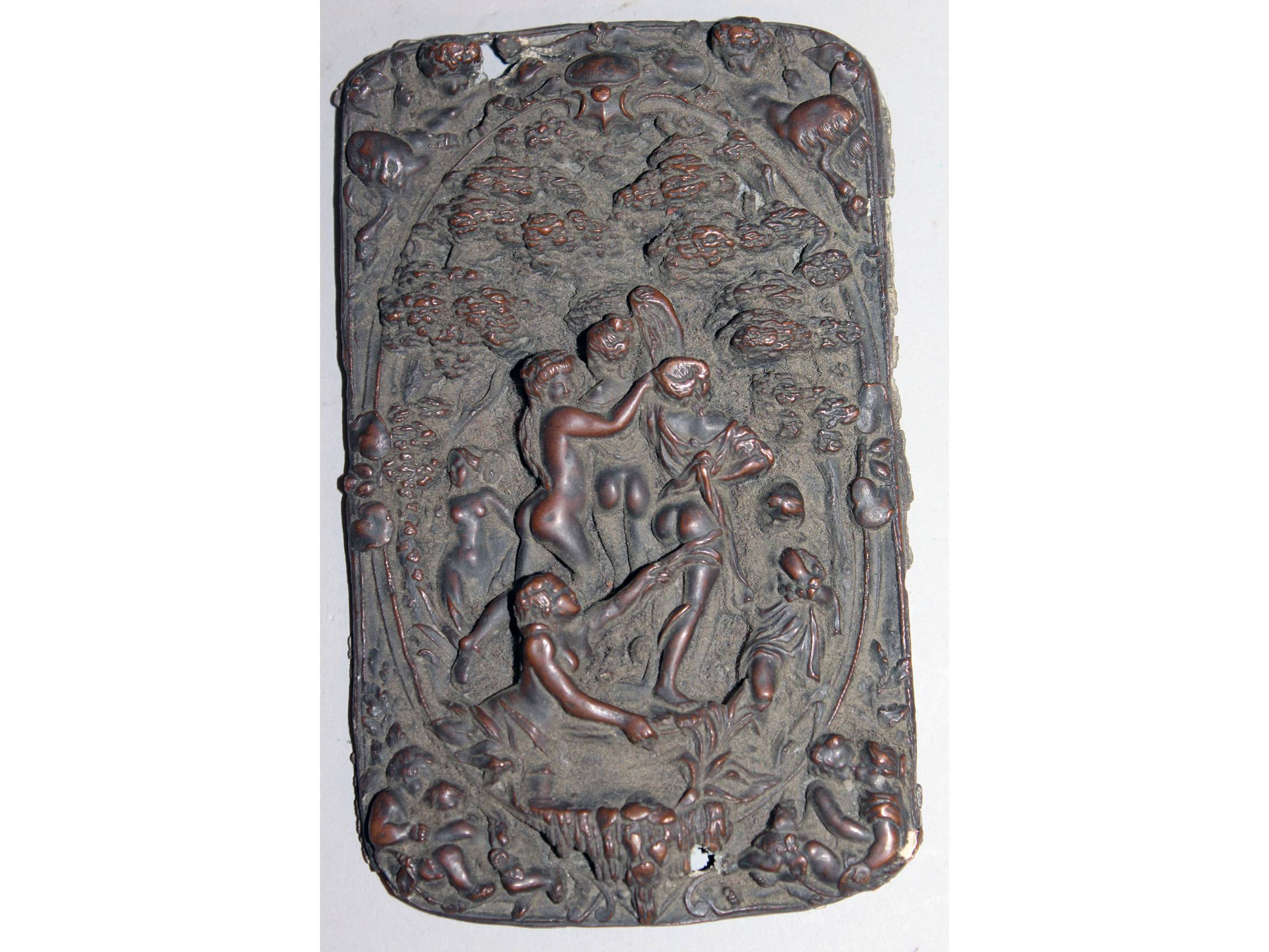 AN EARLY METAL PLAQUE, repousse with a classical scene of maidens. 5ins x 3ins.