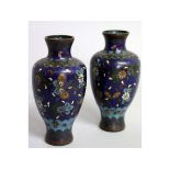 A SMALL PAIR OF JAPANESE CLOISONNE ENAMEL VASES with blue ground. 5.5ins high.