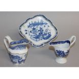 AN 18TH CENTURY NEW HALL CLIP HANDLED JUG printed in blue with a landscape, another New hall cream