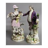 A LARGE PAIR OF MEISSEN FIGURES OF A GALLANT AND LADY, the man a dog at his side, the woman