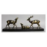 P. MIMAUX. A 1950'S DEER STATUE GROUP of three deer on a marble base. Signed. 22ins long.