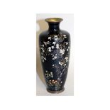 A SMALL JAPANESE BLUE CLOISONNE ENAMEL VASE decorated with birds and flowers. 6ins high.