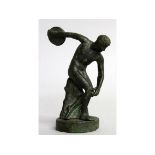 AFTER THE ANTIQUE. A BRONZE DISCUS THROWER on a circular base. 5ins high.