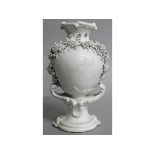 AN 18TH CENTURY CHELSEA DERBY VASE blanc di chine and floral encrusted, patch marks to base.