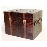 A LEATHER MOCK CROCODILE TRUNK with straps. 1ft 4ins wide.