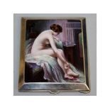 A CIGARETTE CASE with an enamel nude on a bed.