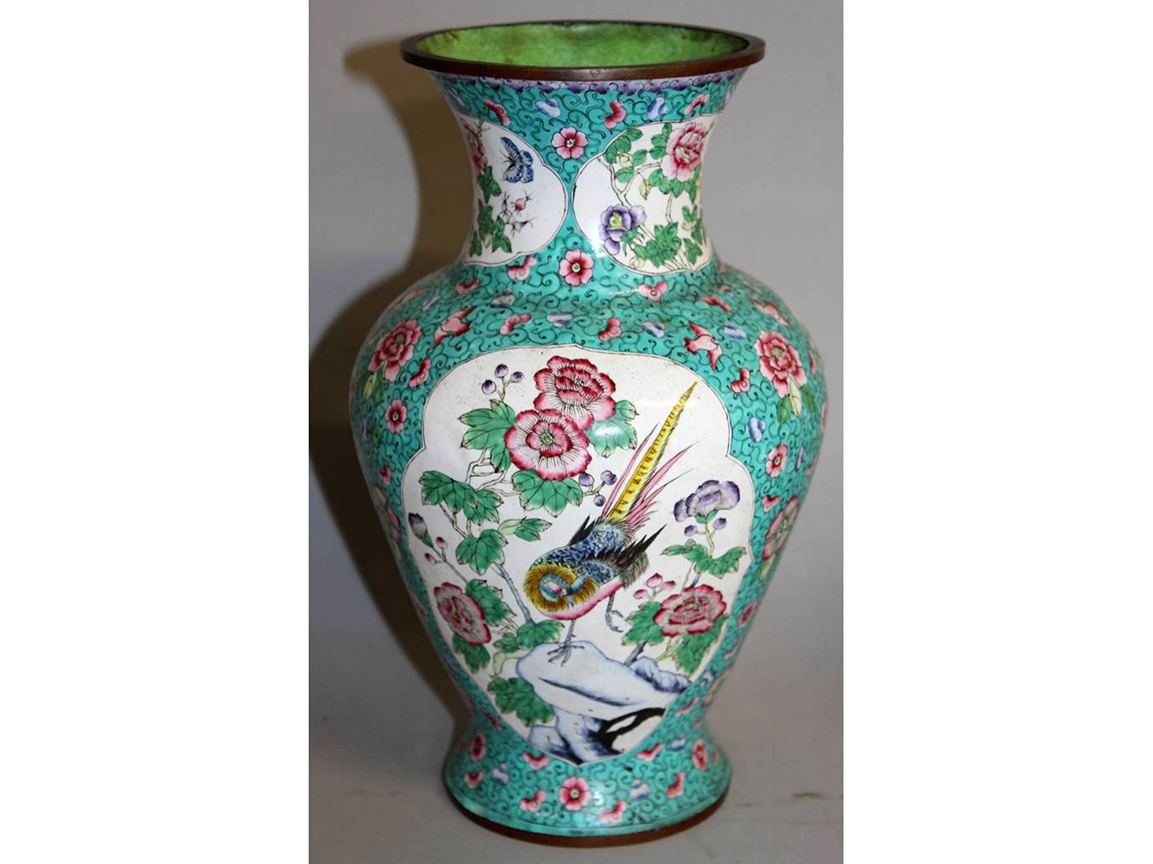 AN EARLY 20TH CENTURY CHINESE CANTON ENAMEL VASE, the sides decorated with shaped panels of birds
