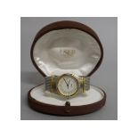 A LADIES "FRED" STEEL & GILT WRISTWATCH in original leather box.