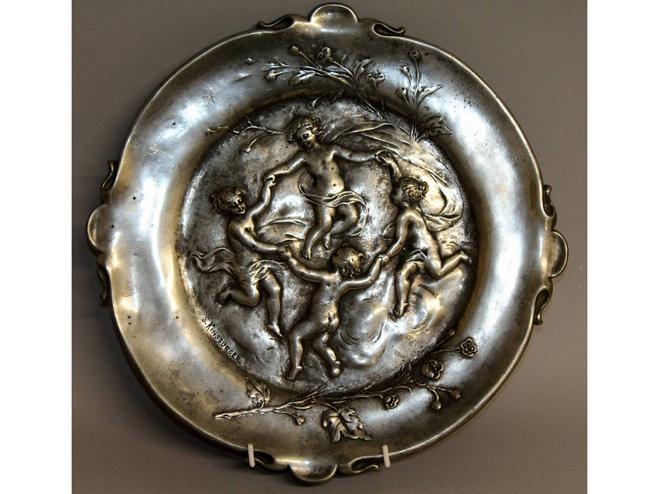 SYLVAN KINSBURGER. A GOOD ART NOUVEAU METAL TRAY decorated with four dancing cupids. Signed. 12ins