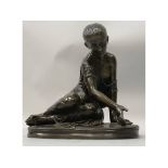 O. THRUBERT A GOOD BRONZE OF A YOUNG GIRL playing dice, on an oval base. 12ins long.