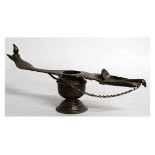 AN INDIAN BRONZE TEMPLE LAMP with chain on a spoon.