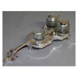 A SILVER PLATED THREE PIECE "VIOLIN SHAPED" CRUET.