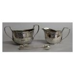 A VICTORIAN ENGRAVED TWO HANDLED SUGAR BASIN and matching CREAM JUG. London 1879 and 1880 and