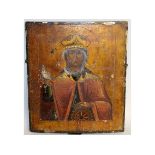A GOOD EARLY RUSSIAN ICON OF A SAINT. 14ins x 12ins.