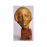 ALBERT PATRISSE (1892-1964) A GILT BRONZE BUST OF A MAN, 5ins high, on a square terracotta base.