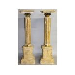 A PAIR OF CREAM MARBLE PEDESTALS with cluster columns and pedestal bases. 3ft 3ins high.