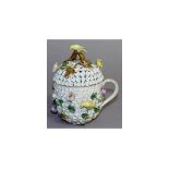 A MEISSEN SNOWBALL CUP AND COVER encrusted with flowers and birds. Cross swords mark in blue.