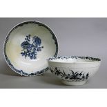 AN 18TH CENTURY LOWESTOFT PUNCH BOWL decorated with flowers in under-glaze blue and a Worcester bowl