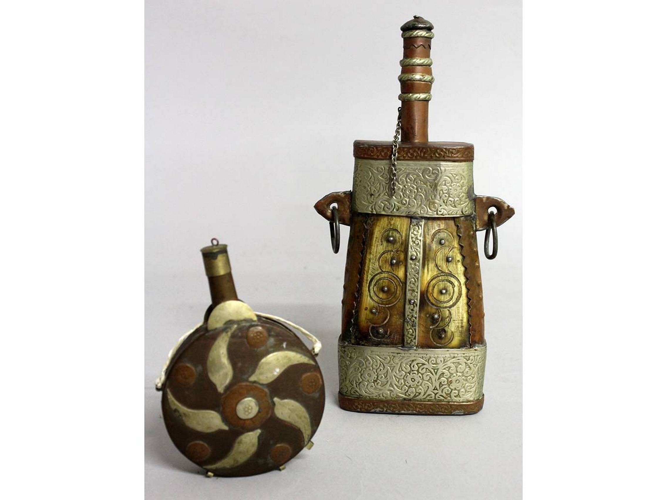 TWO ISLAMIC BONE AND BRASS POWDER FLASKS.