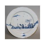 AN 18TH CENTURY RARE ENGLISH DELFT CHARGER painted in blue with an Oriental figure.
