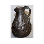 J. GARNIER. AN ART NOUVEAU METAL JUG, repousse with two nude seated female figures. Signed. 6.5ins