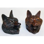 A SMALL PAIR OF "BLACK FOREST" CARVED WOOD INKWELLS.